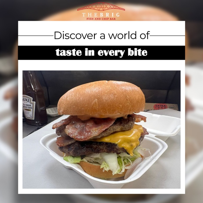 a juicy burger with cheese, lettuce, and beef paired with a sauce inside a 
box served at the brig takeaway in Dunfermline 
