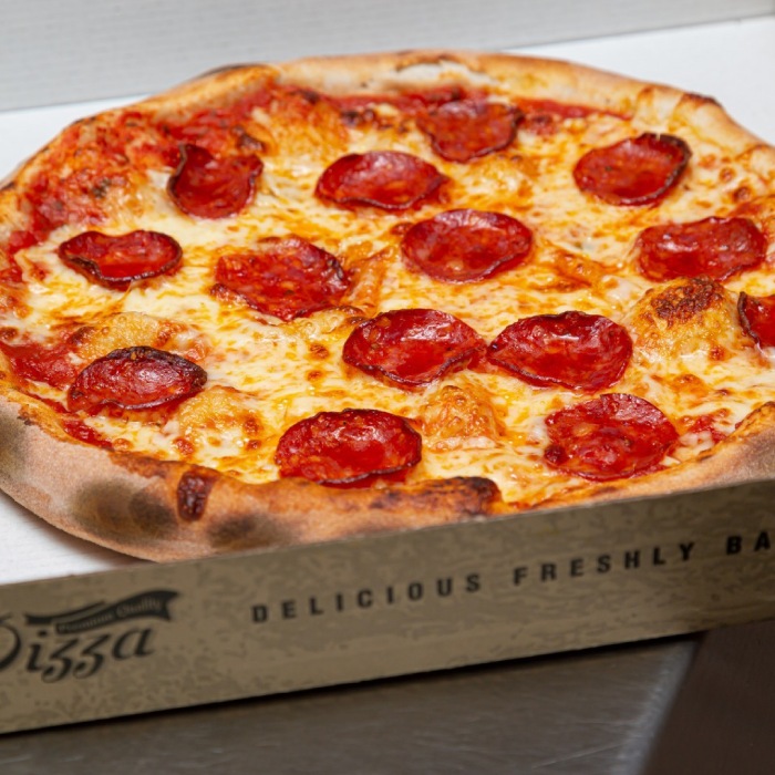 a freshly made pizza in a box served at the brig takeaway in 
Dunfermline 